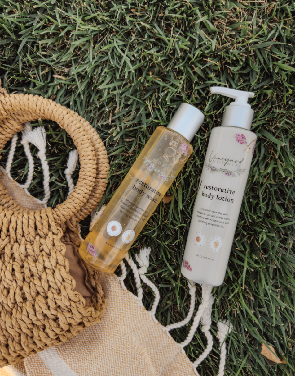Vineyard Morning clean body wash and lotion bottles on grass